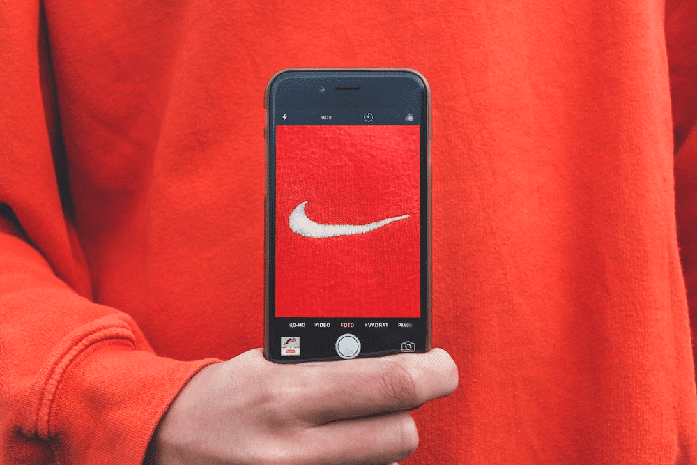 What is a Nike brand ambassador? Nike ambassadors are people who represent Nike in a professional capacity. However, the primary function of brand ambassadors is to promote products and drive sells for Nike by using social media and networking channels. 