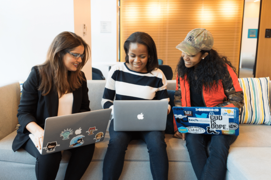 3 women working together on how to set up a brand ambassador program