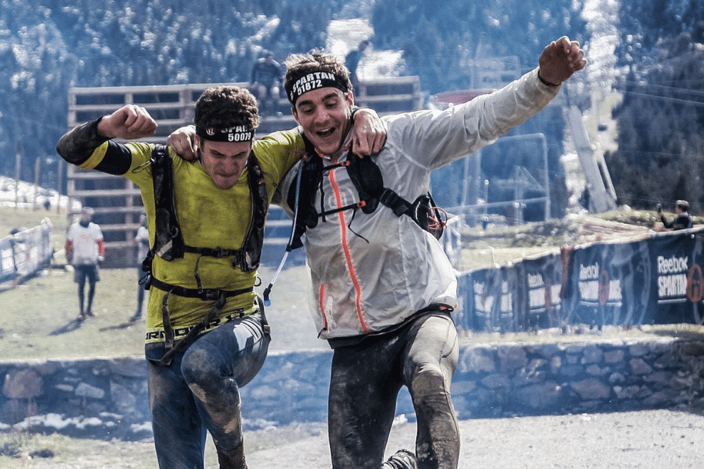 two people finishing the spartan race and being perfect candidates to hire a brand ambassador