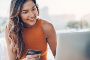 feature image of a women clicking an affiliate link for the blog What is affiliate marketing
